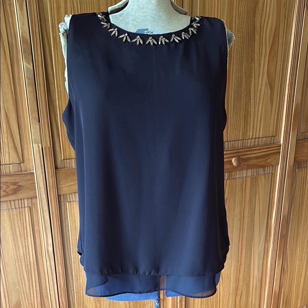 Lovely layered sleeveless blouse with jeweled neckline